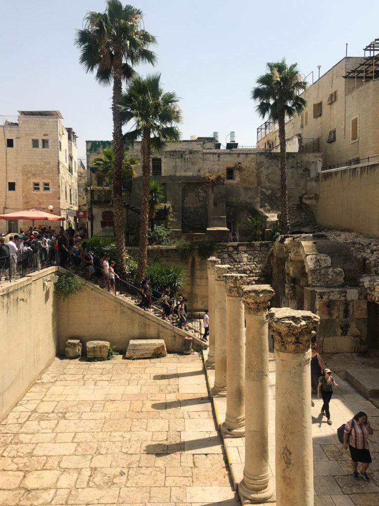 Remnants of the Roman Cardo in the Jewish Quarter of Old City Jerusalem. Free-standing columns, and palm trees.