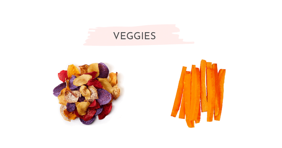 Baked veggie chips and carrot sticks on a white backgroun