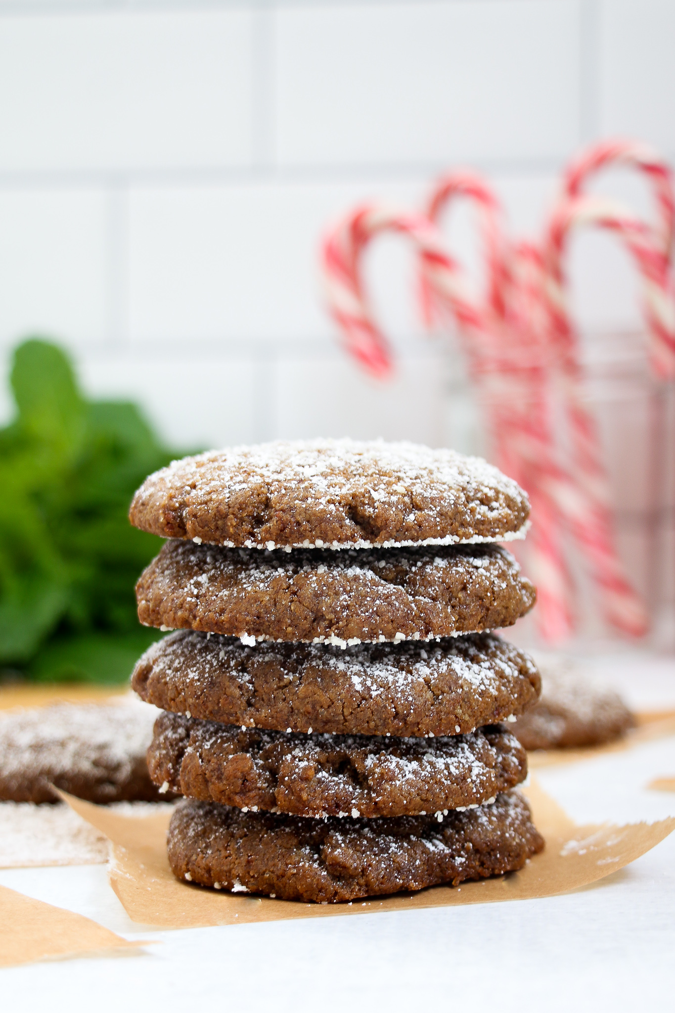 Stack of ginger-molasses cookies on a white backdrop